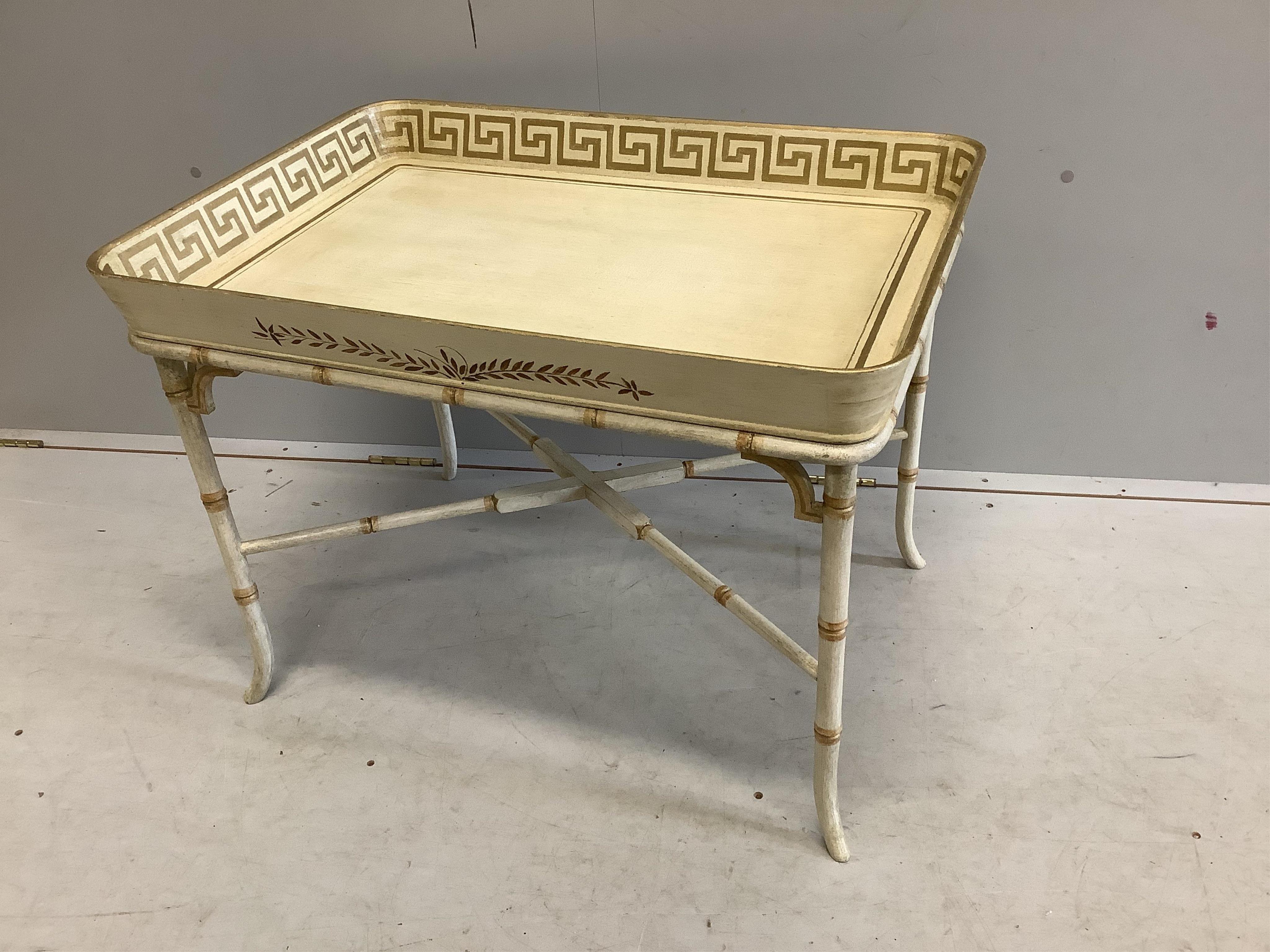 A Regency style rectangular cream painted tray top table, with faux bamboo stand, width 77cm, depth 55cm, height 58cm. Condition - good